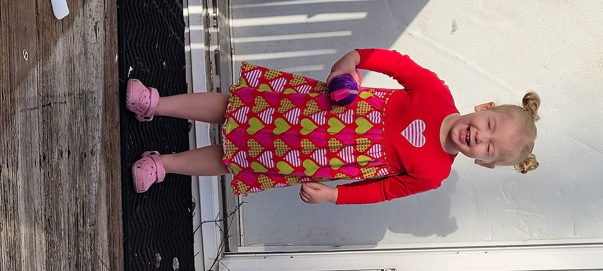 Brinley is registered to the contest to win money with this photo: arm, beauty, child, fun, happy, human_leg, joint, joy, knee, leg, magenta, pattern, person, pink, red, sandal, sleeve, street_fashion, textile, thigh