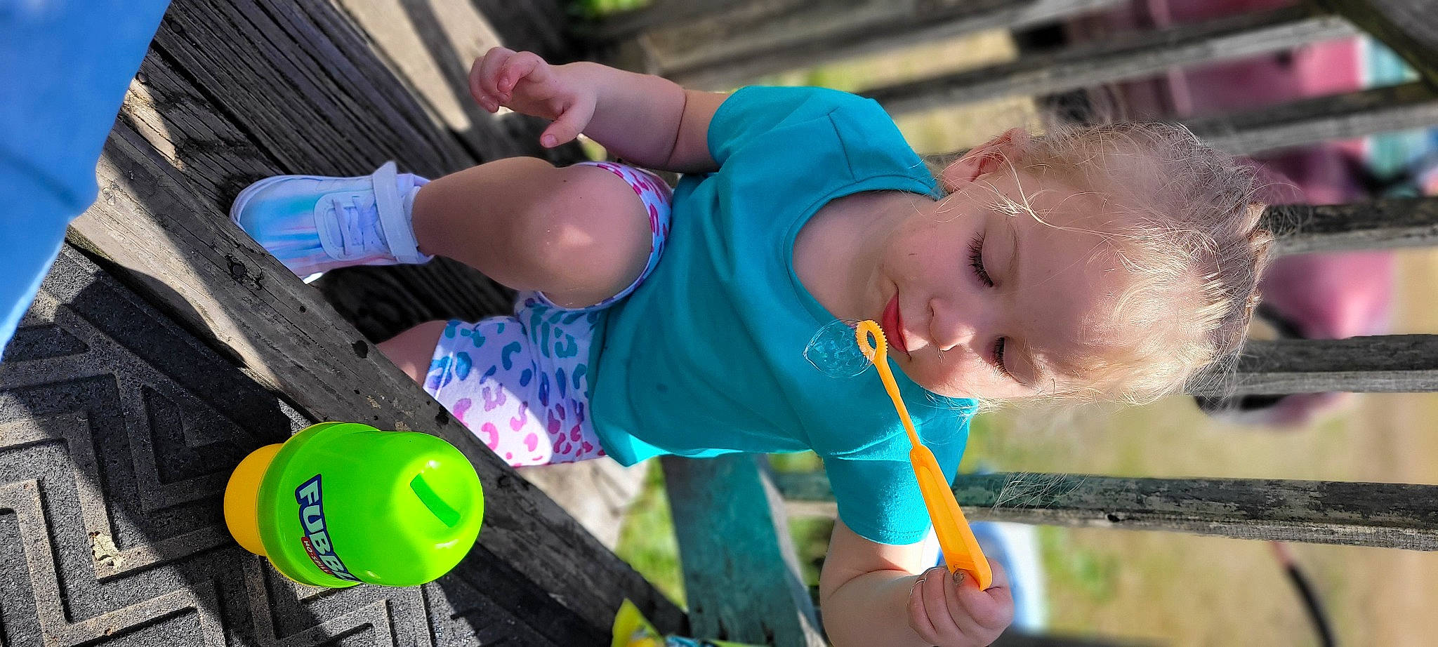 Brinley is registered to the contest to win money with this photo: baby, baby_toddler_clothing, child, city, electric_blue, fun, grass, green, happy, human_leg, knee, leisure, person, play, recreation, sitting, smile, t_shirt, thigh, toddler