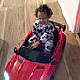 Dontae joined the competition — help win amazing prizes! child, curly_hair, flooring, fun, happy, headlights, indoor, kid, pajamas, playtime, red_car, room, smiling, steering_wheel, toddler, toy_car, tricycle, vehicle, wooden_floor, young_child