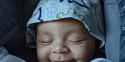 Dontae joined the competition — help win amazing prizes! baby, blanket, bundle, car_seat, child, closed_eyes, clothing, comfort, cozy, cute, face, happy, hat, headwear, infant, portrait, resting, sleeping, smile, young_child