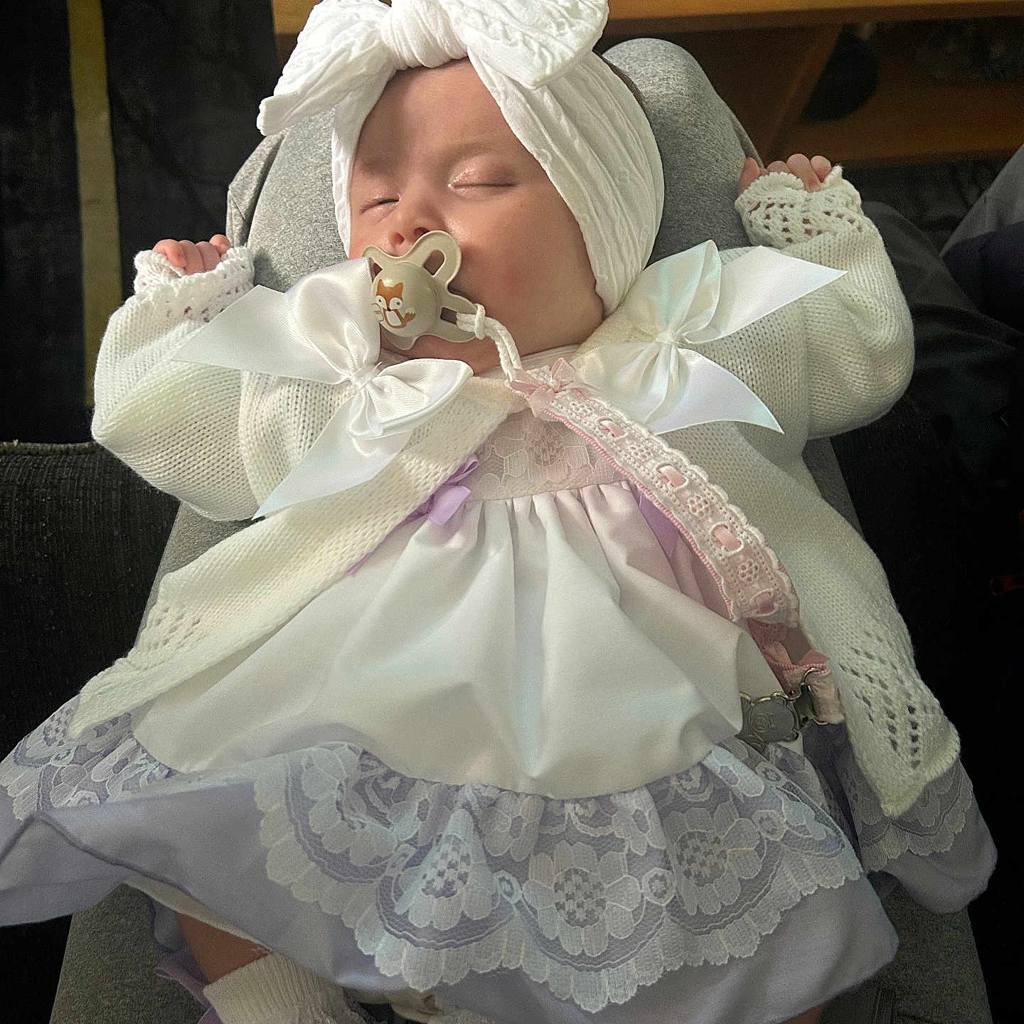 Marla-Mae joined the competition — help win amazing prizes! baby, bow, clothing, cute, glass_table, headwrap, indoor, infant, knitted_cardigan, lace_dress, lace_trim, lap, pacifier, peaceful, person, pink, resting, sleeping, socks, table