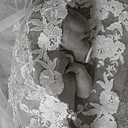 Piper is registered to the contest to win money with this photo: baby, infant, pacifier, lace, floral_pattern, black_and_white, newborn, sleeping, delicate, textile, fabric, portrait, closeup, soft, peaceful, hand, face, skin, blanket, resting