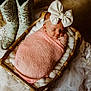 Piper joined the competition — help win amazing prizes! newborn, baby, sleeping, pink_blanket, bow_headband, basket, cowboy_boots, cozy, soft_lighting, fluffy_padding, rustic, ornate, turquoise, head, wrapped, indoor, cute, peaceful, portrait, infant