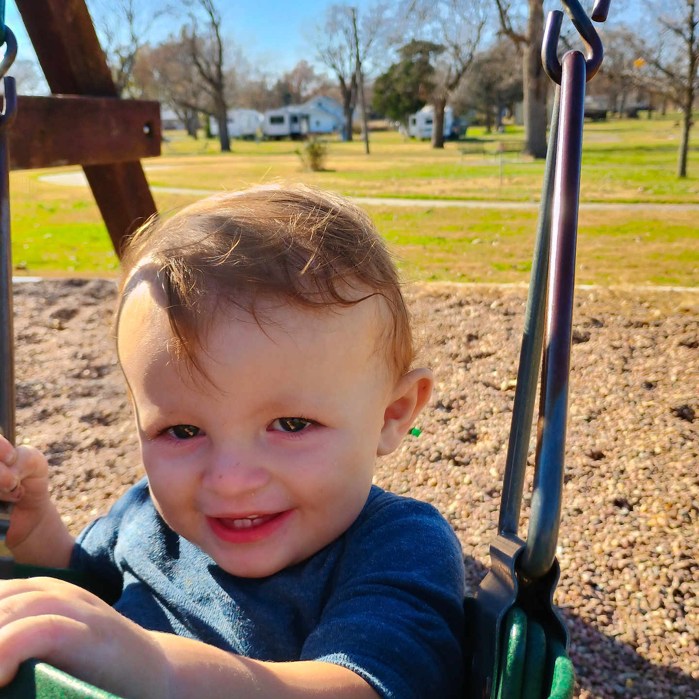 Lane joined the competition — help win amazing prizes! blue_sky, child, clothing, daylight, fun, grass, green, happy, nature, outdoor, park, person, play, playground, seat, smile, swing, toddler, trees, young_child
