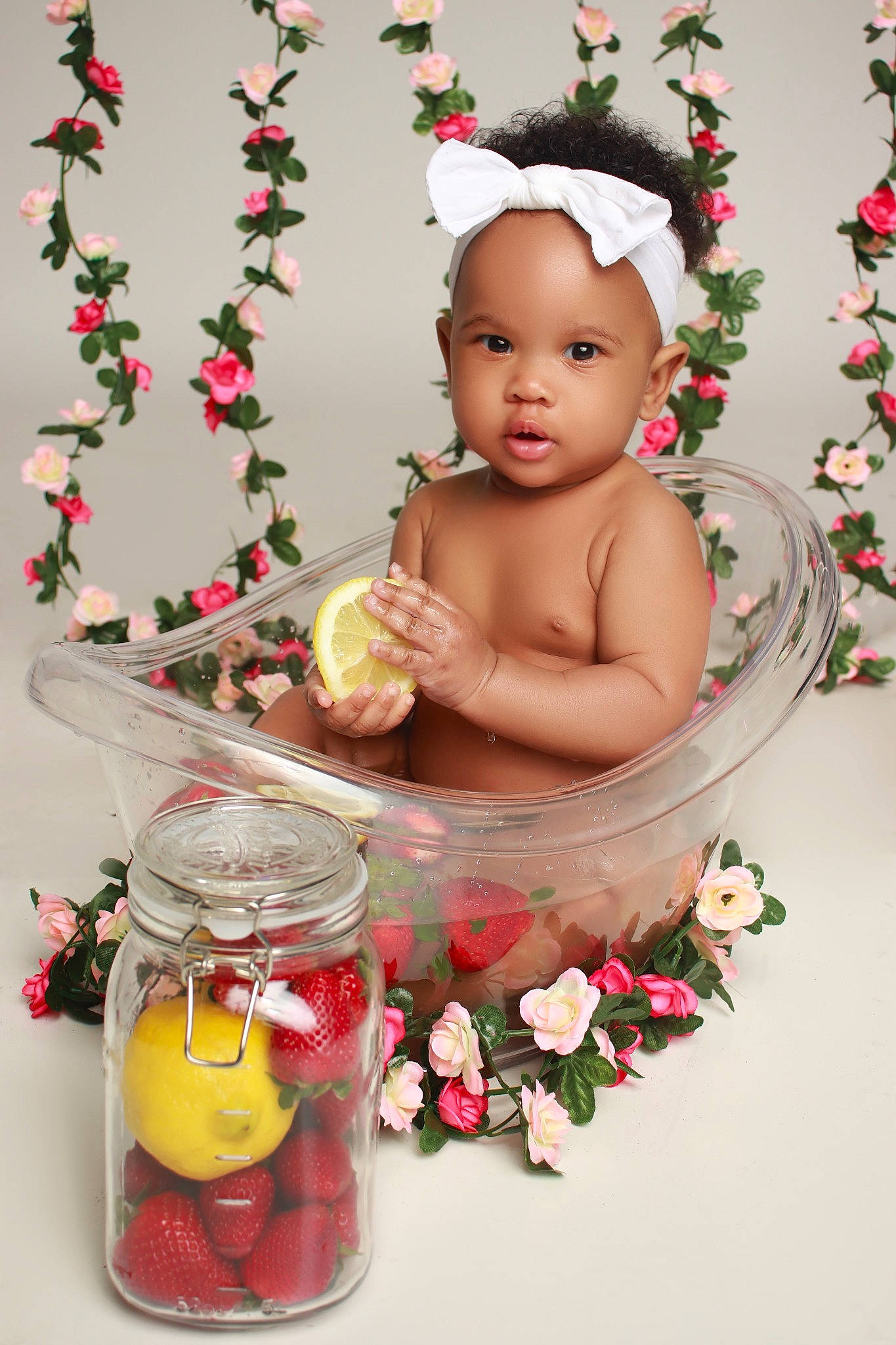 Solace is registered to the contest to win money with this photo: baby, baby_toddler_clothing, christmas_decoration, cut_flowers, event, floral_design, flower_arranging, food, fruit, happy, natural_foods, ornament, person, petal, pink, rose, serveware, sitting, sweetness, tableware