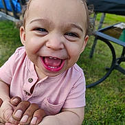 Corbin is registered to the contest to win money with this photo: toddler, child, smiling, happy, outdoor, grass, hands, person, face, shirt, pink_clothing, baby, daylight, portrait, closeup, curly_hair, fun, joy, nature, family