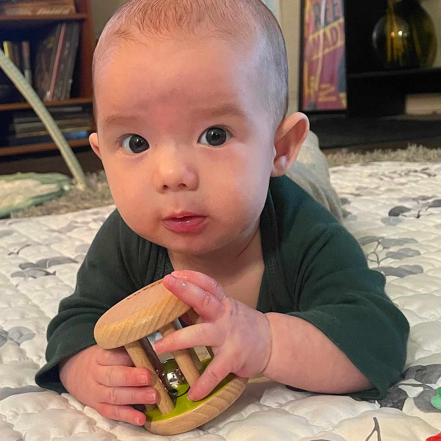 Jace is registered to the contest to win money with this photo: baby, bodypart, cutlery, eating, face, finger, furniture, hand, head, indoors, interiordesign, kitchenutensil, person, photography, pingpong, pingpongpaddle, portrait, racket, sitting, sport