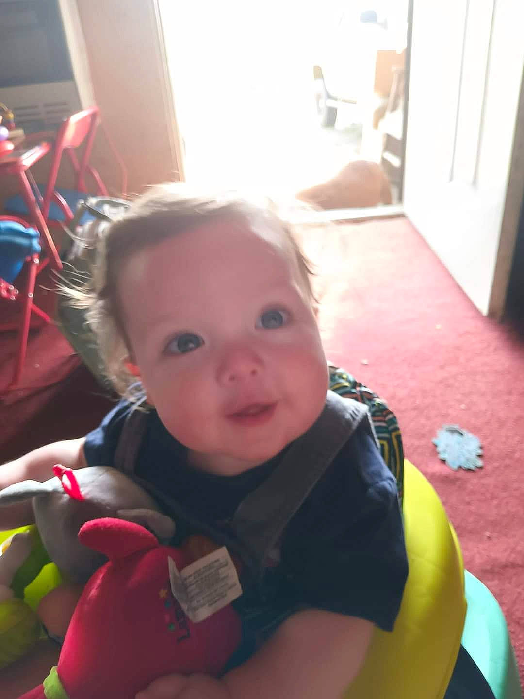 Weston is registered to the contest to win money with this photo: baby, baby_carriage, baby_products, baby_toddler_clothing, cheek, child, door, flooring, fun, happy, home_door, iris, mouth, nose, person, room, sitting, skin, toddler, vacation