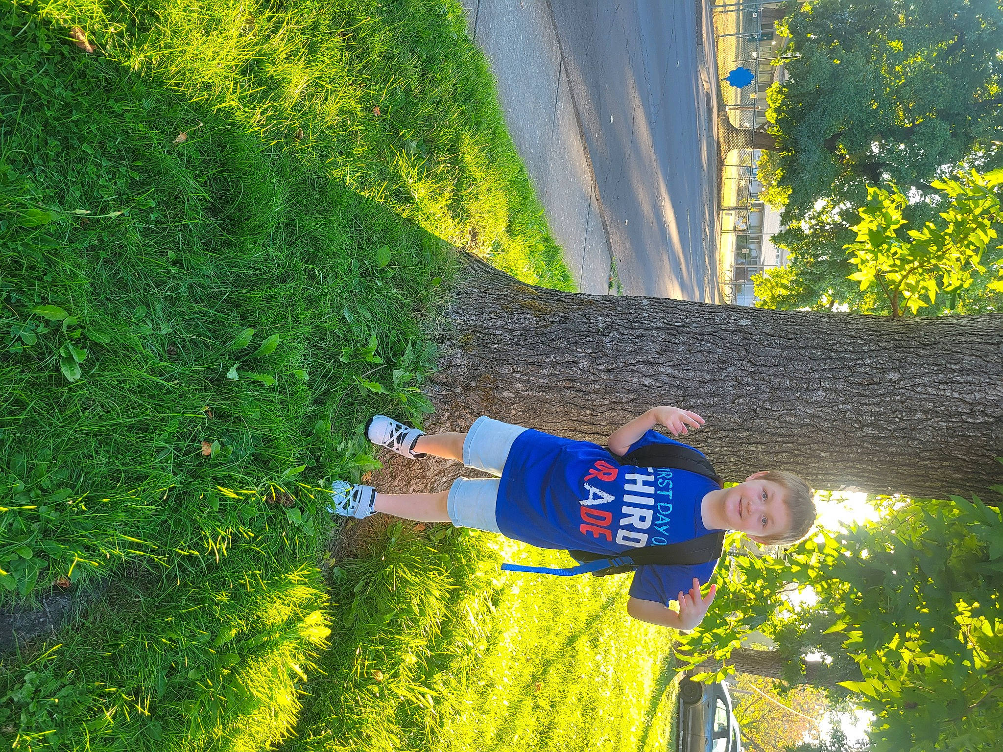 Landyn is registered to the contest to win money with this photo: child, electric_blue, fun, grass, grassland, happy, joy, landscape, leisure, people_in_nature, person, plant, recreation, shadow, shrub, soil, t_shirt, tree, yellow