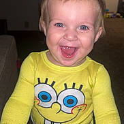 Logan joined the competition — help win amazing prizes! toddler, child, smiling, yellow_clothing, spongebob, indoor, happy, face, person, baby, long_sleeve, blue_eyes, short_hair, home, carpet, hand, toy, furniture, cheerful, portrait
