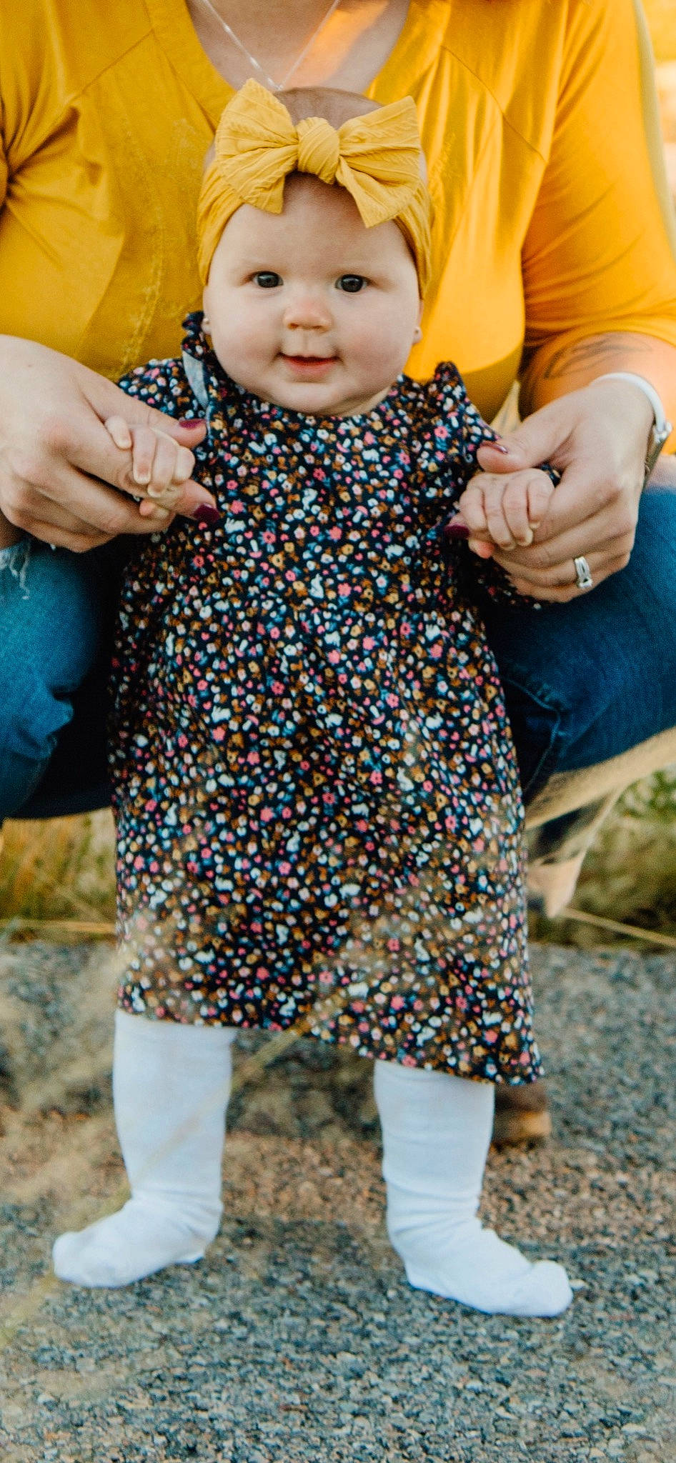 Charlotte is registered to the contest to win money with this photo: azure, baby, baby_toddler_clothing, blue, clothing, finger, gesture, hand, headwear, joint, leaf, outerwear, people_in_nature, person, photograph, sleeve, smile, standing, street_fashion, textile