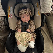 Oaklyn is registered to the contest to win money with this photo: baby, infant, car_seat, leopard_print, headband, blanket, socks, indoor, child, young_child, seatbelt, cushion, person, clothing, cute, portrait, baby_clothes, fabric, home, car_seat_cover