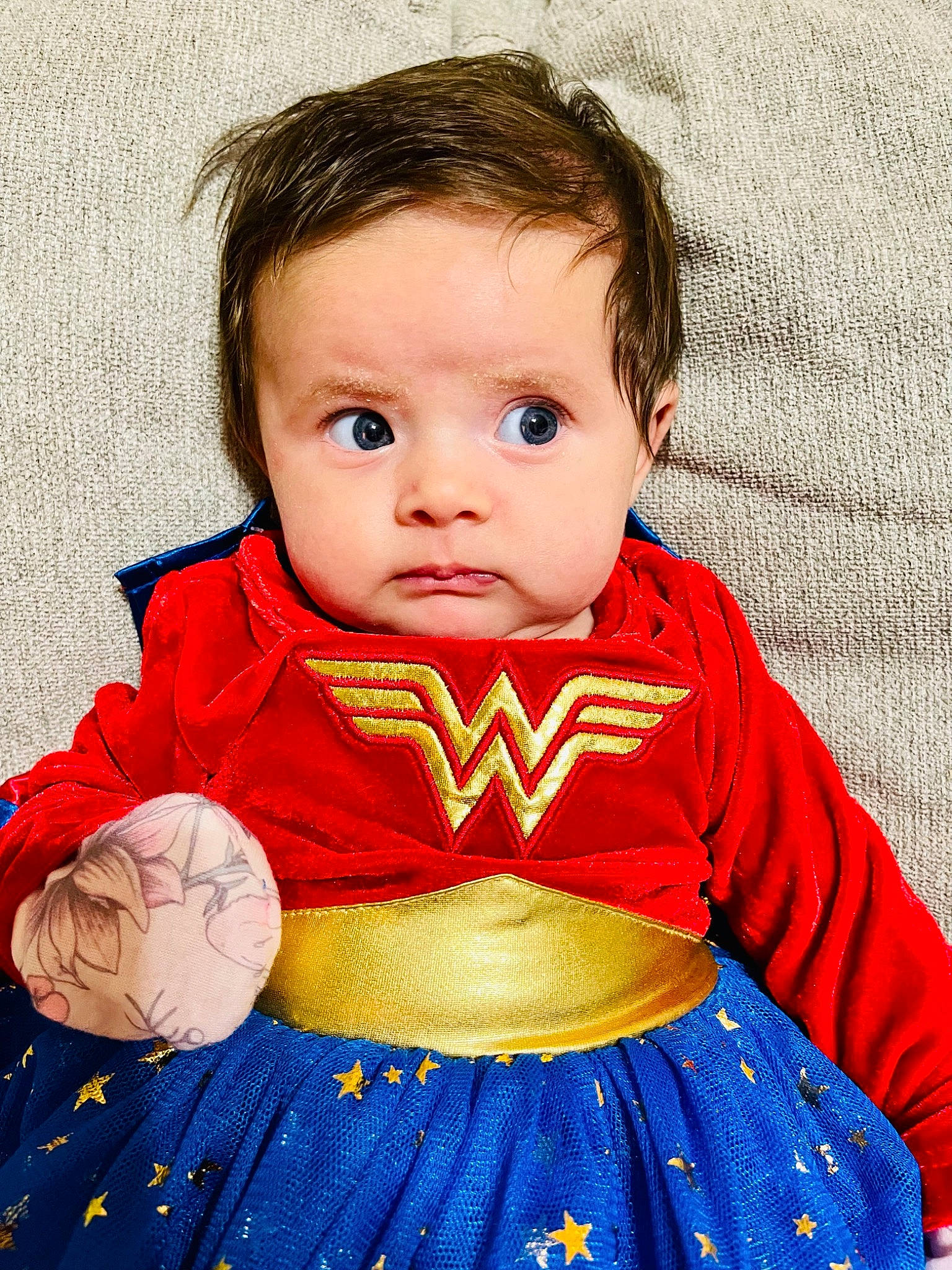 Elaine is registered to the contest to win money with this photo: arm, baby_toddler_clothing, cheek, child, clothing, dress, eye, flash_photography, football, happy, head, iris, lip, nose, organ, outerwear, person, skin, sleeve, toddler