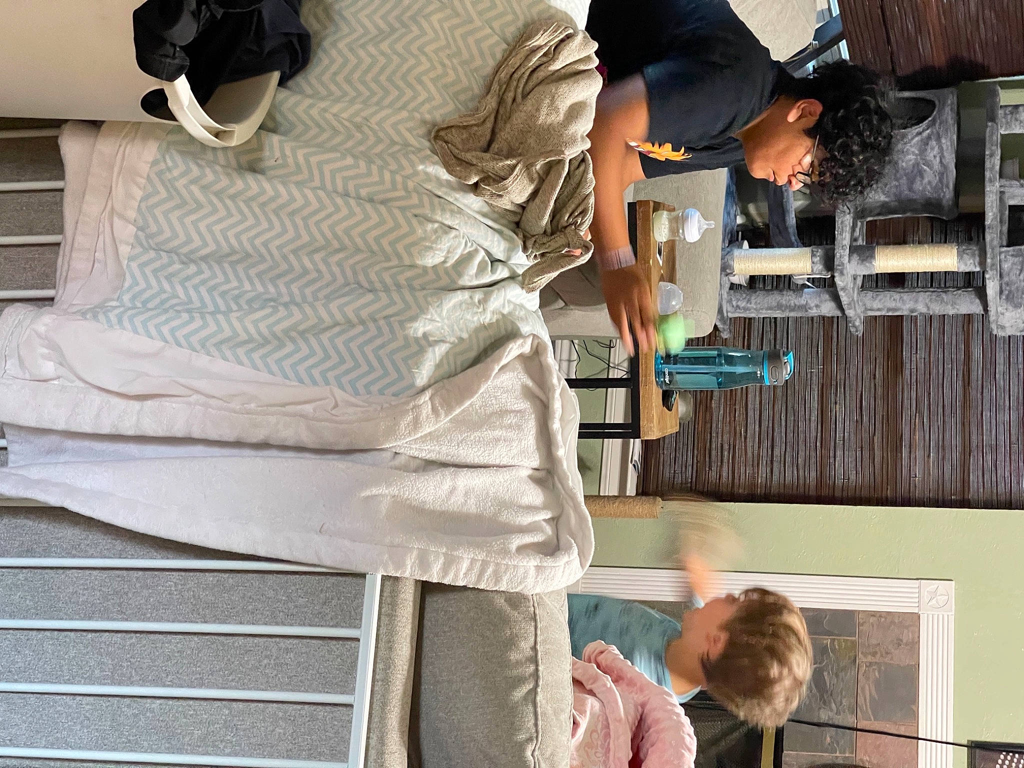 Jaxon is registered to the contest to win money with this photo: comfort, elbow, eyewear, fashion_design, hat, human_leg, leisure, linens, pattern, person, room, shirt, shorts, sitting, sleeve, street_fashion, t_shirt, vacation, waist, white