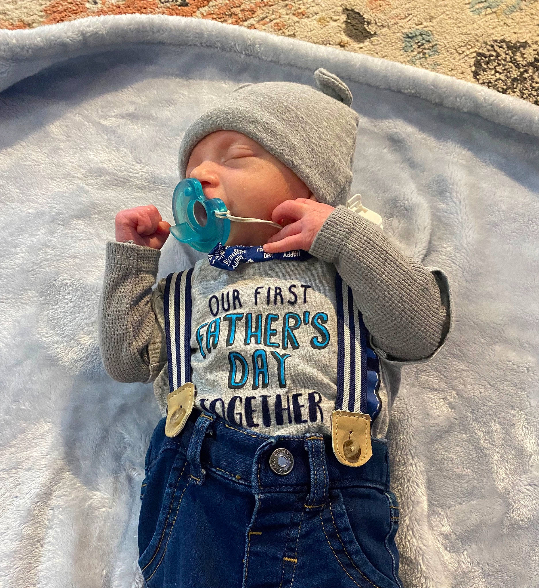 Casey is registered to the contest to win money with this photo: baby, baby_toddler_clothing, cap, electric_blue, face, freezing, grass, happy, headgear, headwear, hood, jacket, knit_cap, outerwear, people_in_nature, person, sleeve, snow, street_fashion, t_shirt