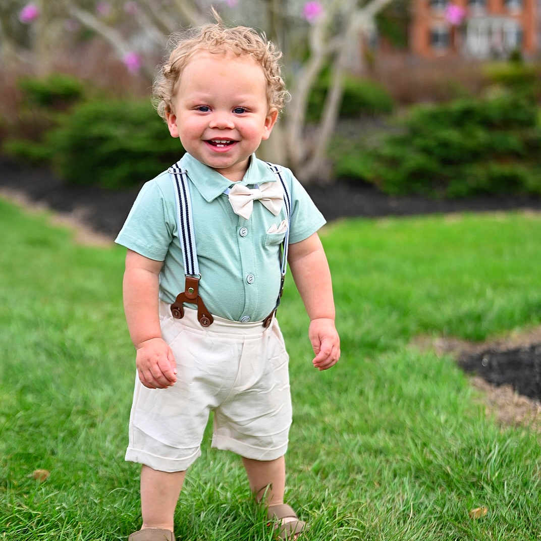 Kannyn is registered to the contest to win money with this photo: backyard, boy, child, clothing, face, grass, head, lawn, male, nature, outdoors, pants, park, person, photography, plant, portrait, shorts, tree, yard