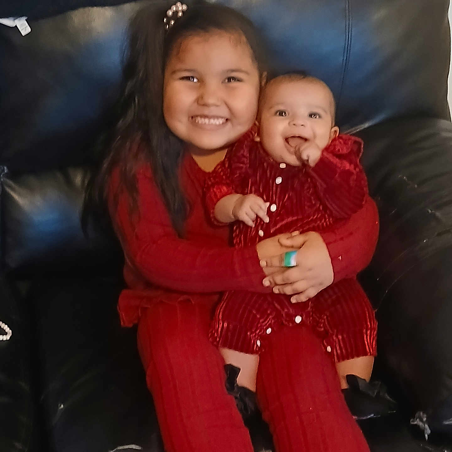 Alyja is registered to the contest to win money with this photo: baby, chair, clothing, coat, couch, cushion, face, furniture, happy, head, homedecor, knitwear, pants, people, person, photography, portrait, sitting, smile, sweater