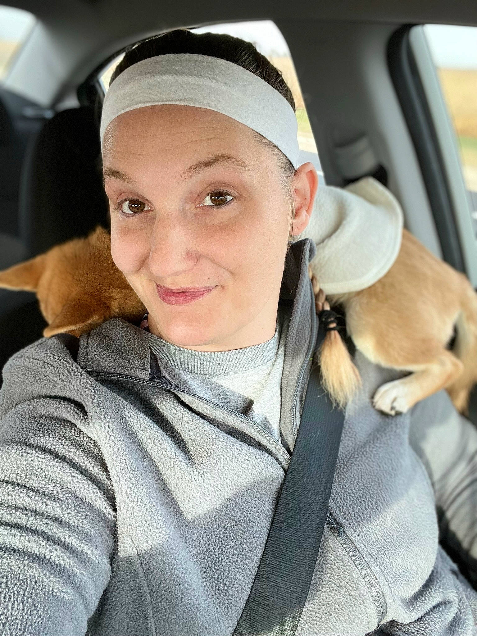 Jersey is registered to the contest to win money with this photo: auto_part, automotive_exterior, automotive_window_part, cap, car, car_seat, car_seat_cover, comfort, family_car, finger, hat, head_restraint, luxury_vehicle, motor_vehicle, seat_belt, smile, steering_wheel, tree, vehicle_door, window