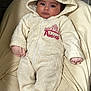 Hazel is registered to the contest to win money with this photo: baby, infant, onesie, hood, cute, blanket, soft, pink, princess, sleepwear, child, face, eyes, hands, feet, cozy, warm, indoor, portrait, laying