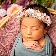 Hazel joined the competition — help win amazing prizes! newborn, baby, infant, sleeping, flower_crown, blanket, basket, plush, soft_texture, closeup, portrait, peaceful, cute, child, headband, wrapped, resting, floral, pink, pastel