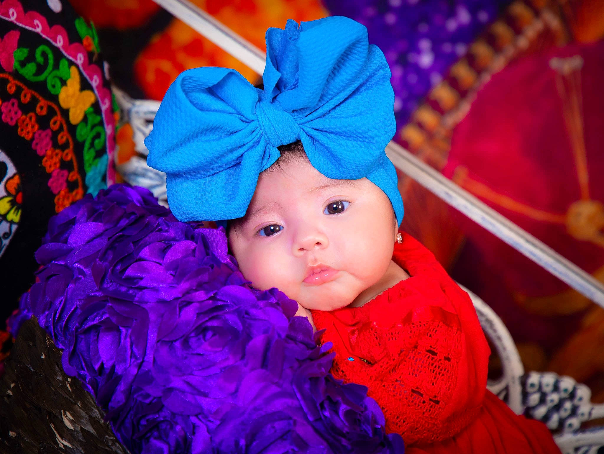 Kamilah is registered to the contest to win money with this photo: baby, baby_toddler_clothing, costume_hat, doll, electric_blue, event, fun, happy, headgear, headwear, holiday, magenta, person, pink, product, purple, sun_hat, textile, toddler, toy