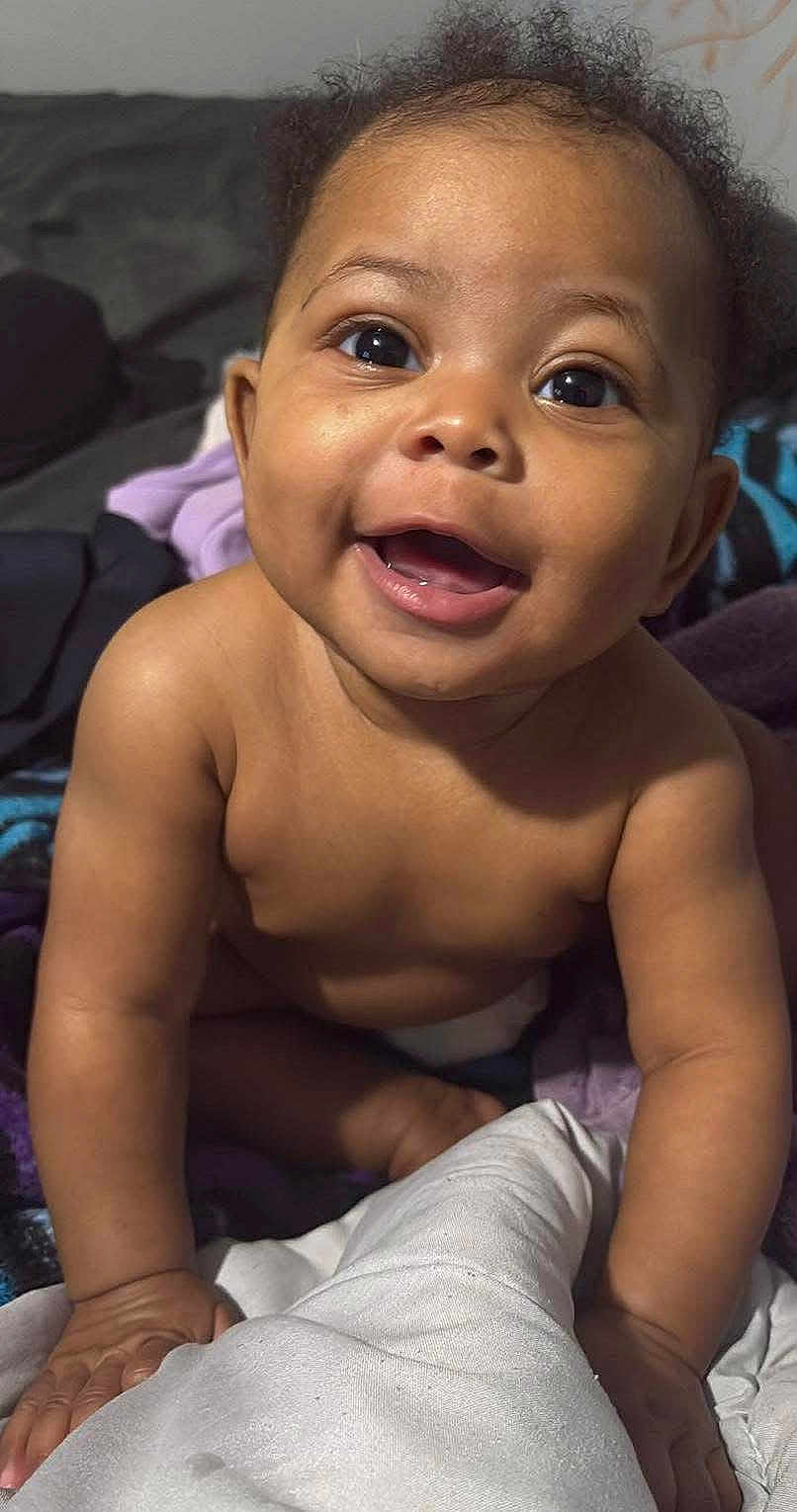 Ivy is registered to the contest to win money with this photo: baby, child, smiling, happy, face, skin, arms, indoor, blanket, expression, cute, infant, portrait, young, person, playful, closeup, human, toddler, warm