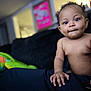 Ivy joined the competition — help win amazing prizes! baby, child, dimples, pigtails, hand, toy, plush, couch, indoor, person, portrait, skin, face, curious, seated, living_room, soft_lighting, closeup, expression, casual
