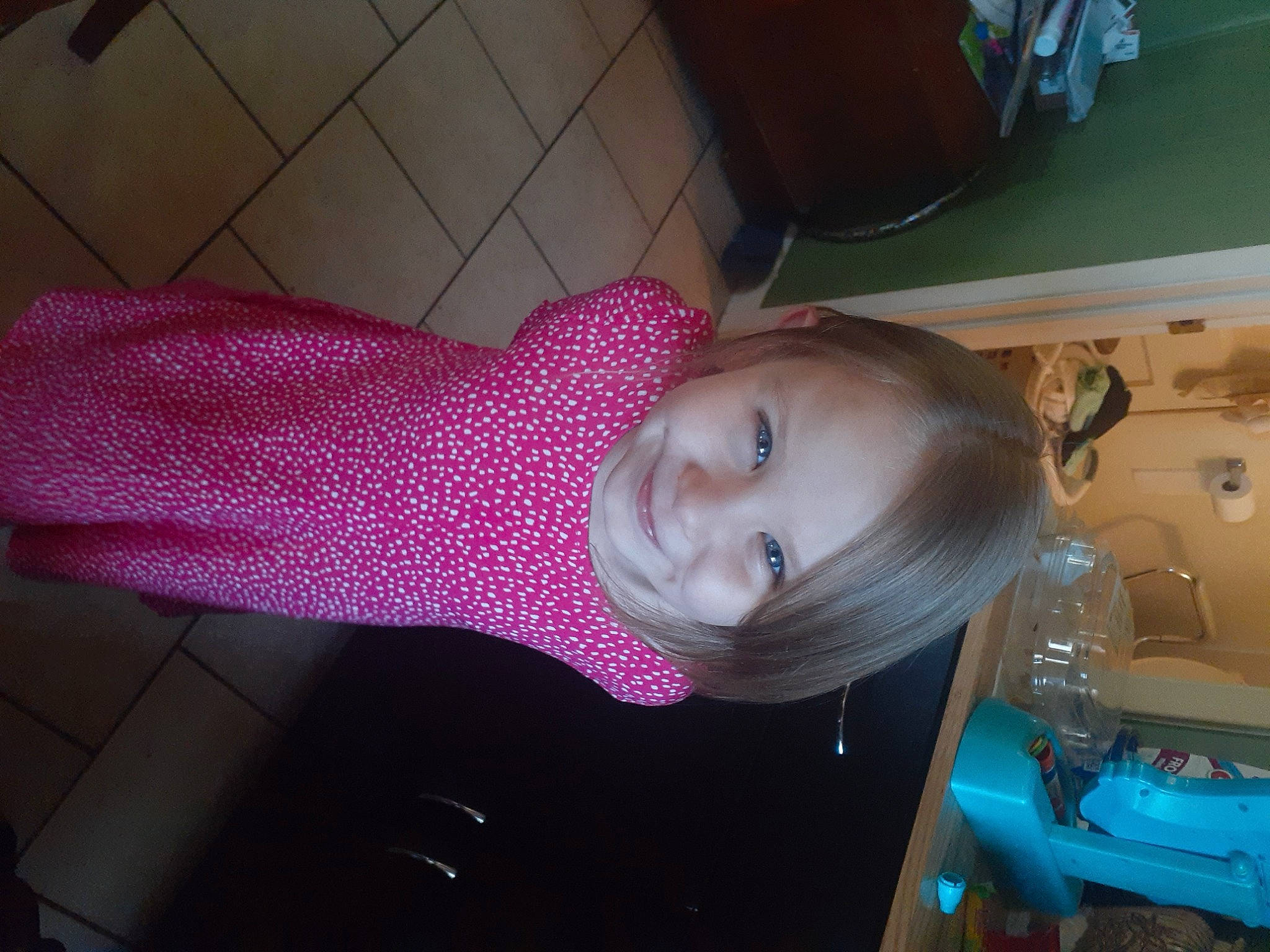 Karly is registered to the contest to win money with this photo: baby_products, chest, child, fashion_accessory, flooring, fun, hair_coloring, joy, magenta, pattern, person, plastic, purple, room, smile, toddler