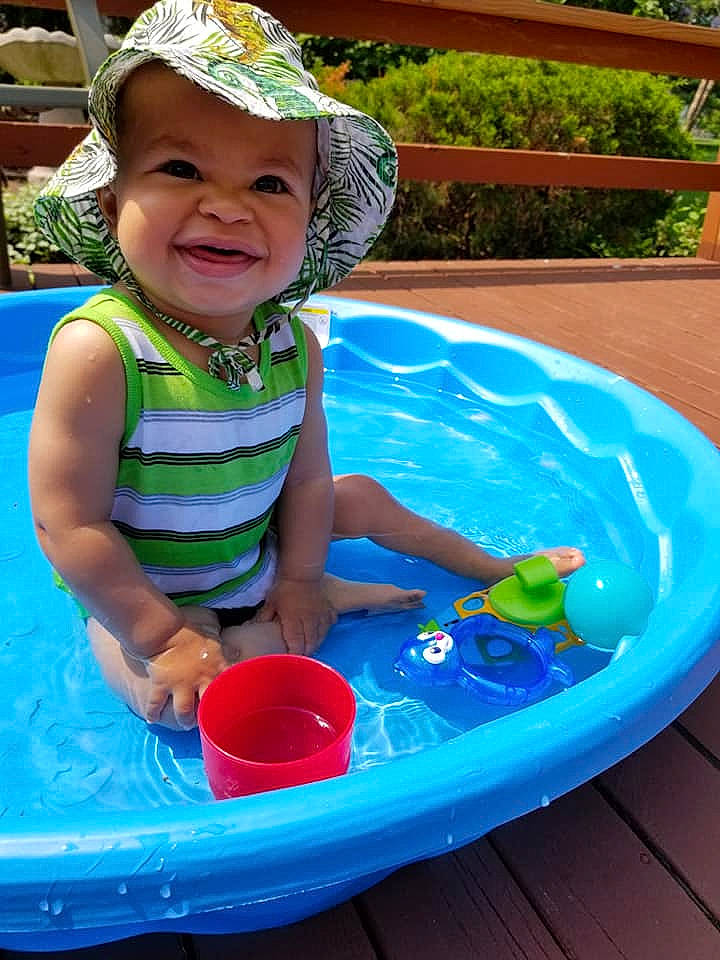 Dane is registered to the contest to win money with this photo: child, fun, headwear, leisure, person, play, summer, toddler, toy, vacation, water