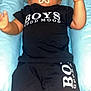 Ilyess participe au concours pour gagner de l'argent avec cette photo : arms, baby, black_clothing, blue_cushion, child, cushion, expressionless, face, head, indoor, infant, legs, lying_down, pacifier, person, relaxed, shorts, skin, tshirt, young_child