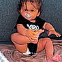 Ilyess a rejoint le concours — aidez-le/la à gagner de superbes lots ! baby, infant, pacifier, black_onesie, blanket, couch, indoor, child, cute, sitting, foot, hand, face, hair, expression, skin, comfort, cozy, young, person