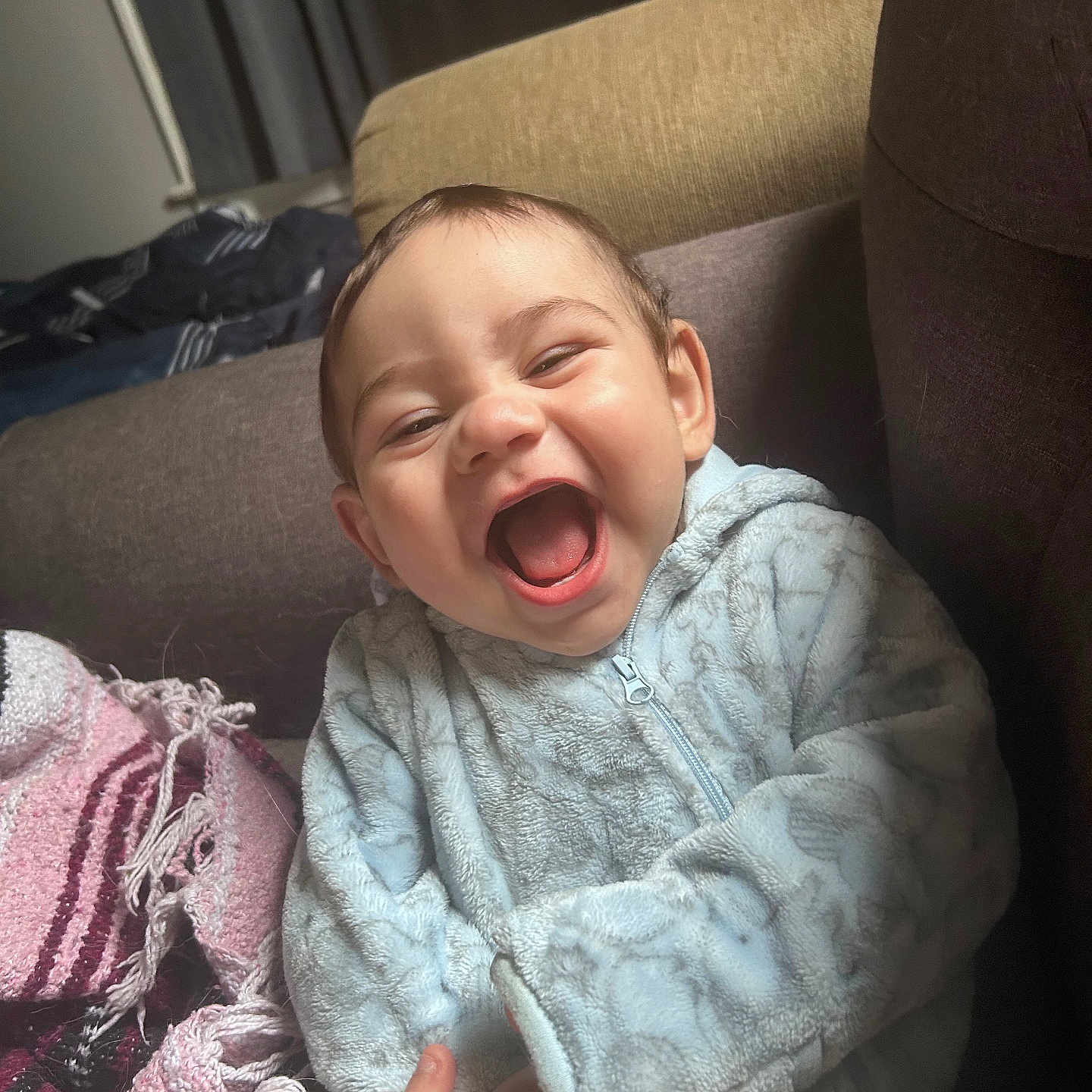 Michael is registered to the contest to win money with this photo: baby, blanket, child, comfort, couch, cozy, cute, fleece_jacket, hand, happy, home, indoor, laughing, person, pink, portrait, purple, smiling, soft, warm