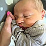 Waylon is registered to the contest to win money with this photo: newborn, baby, sleeping, hand, nail_polish, blanket, cozy, peaceful, closeup, face, skin, infant, soft, wrapped, resting, portrait, cute, tender, comfort, person