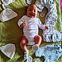 Evan David participe au concours pour gagner de l'argent avec cette photo : baby, infant, smiling, white_onesie, green_blanket, baby_clothes, baby_hats, baby_socks, diapers, panda_sticker, laying_down, happy, cute, soft_texture, baby_mitten, baby_garments, child, indoor, newborn, portrait