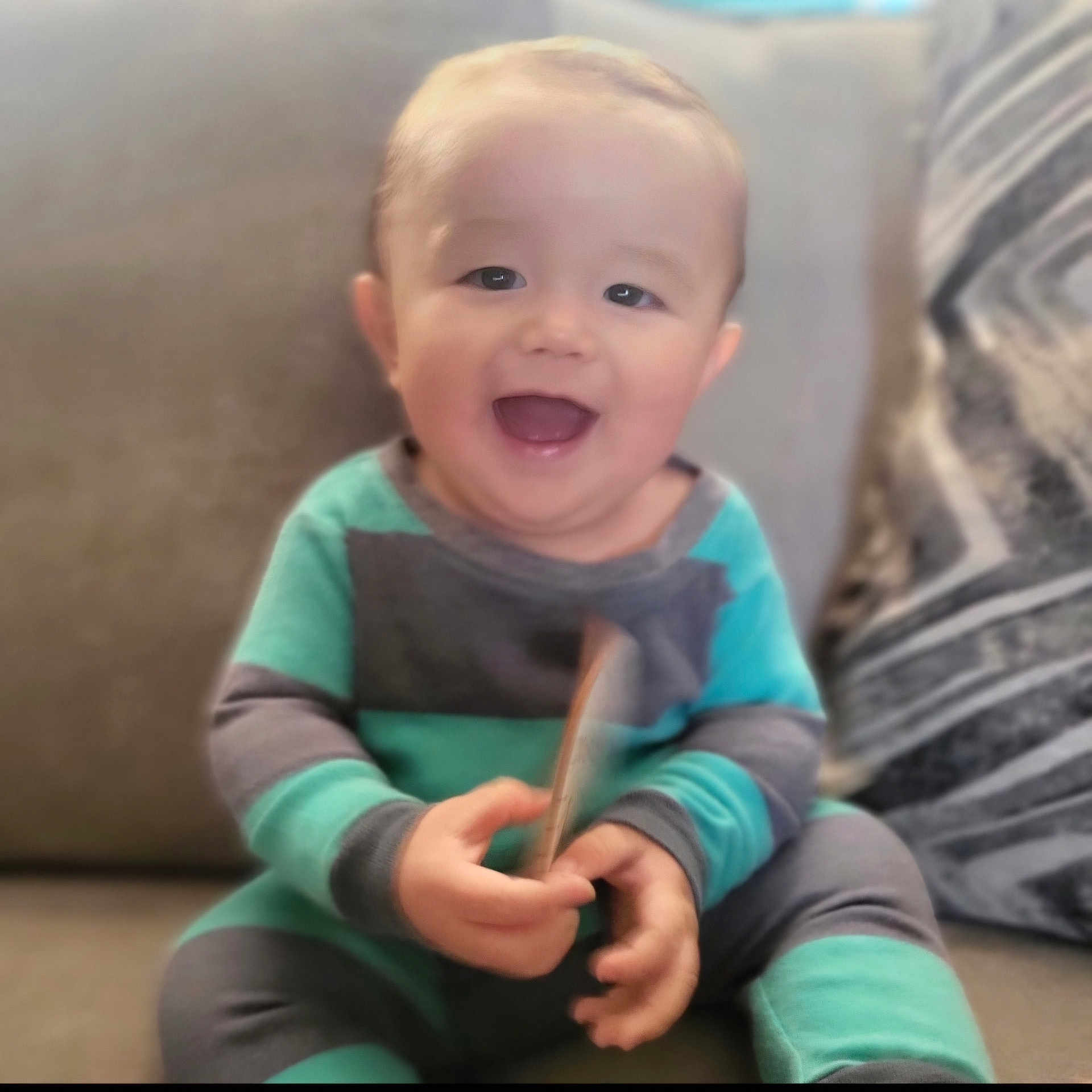 Anakin joined the competition — help win amazing prizes! baby, babylaughing, bodypart, clothing, couch, cutlery, face, finger, furniture, hand, happy, head, laughing, pants, person, photography, portrait, sitting, smile, spoon