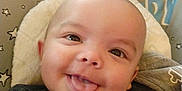 Revan joined the competition — help win amazing prizes! baby, smiling, tongue_out, face, head, infant, cushion, star_pattern, clothing, cozy, happy, child, cute, indoors, portrait, person, baby_seat, expression, closeup, joy