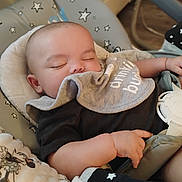 Revan joined the competition — help win amazing prizes! baby, sleeping, bib, baby_seat, stars, infant, peaceful, hand, clothing, blanket, comfort, cute, child, indoor, portrait, resting, soft, toddler, nap, closeup