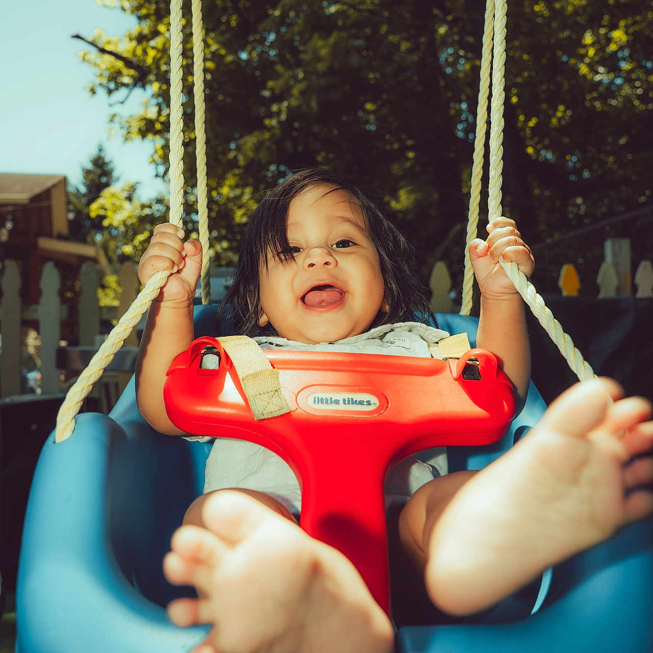 Jared joined the competition — help win amazing prizes! toddler, child, swing, outdoor, play, happy, feet, sunlight, trees, rope, blue_swing, red_safety_bar, smile, baby, daylight, fence, playground, fun, person, summer