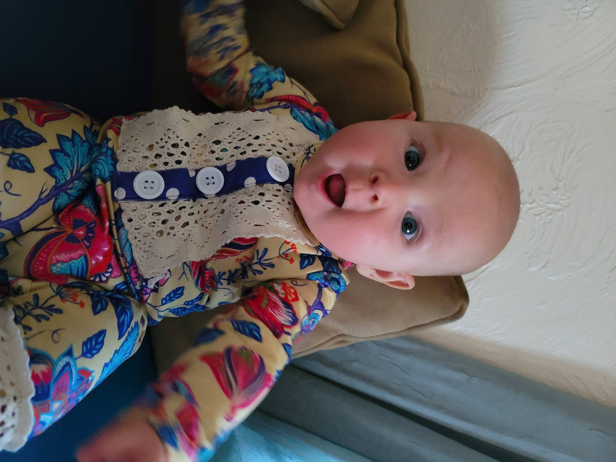 Delaney is registered to the contest to win money with this photo: arm, baby, baby_products, baby_toddler_clothing, cheek, chest, comfort, eye, headgear, human_body, linens, lip, mouth, nail, neck, nose, pattern, person, skin, sleeve