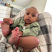 Apollo joined the competition — help win amazing prizes! baby, infant, pajamas, feet, hand, blanket, pacifier, bracelet, face, expression, indoor, crib, balloon, spongebob, child, person, home, soft, curious, cozy