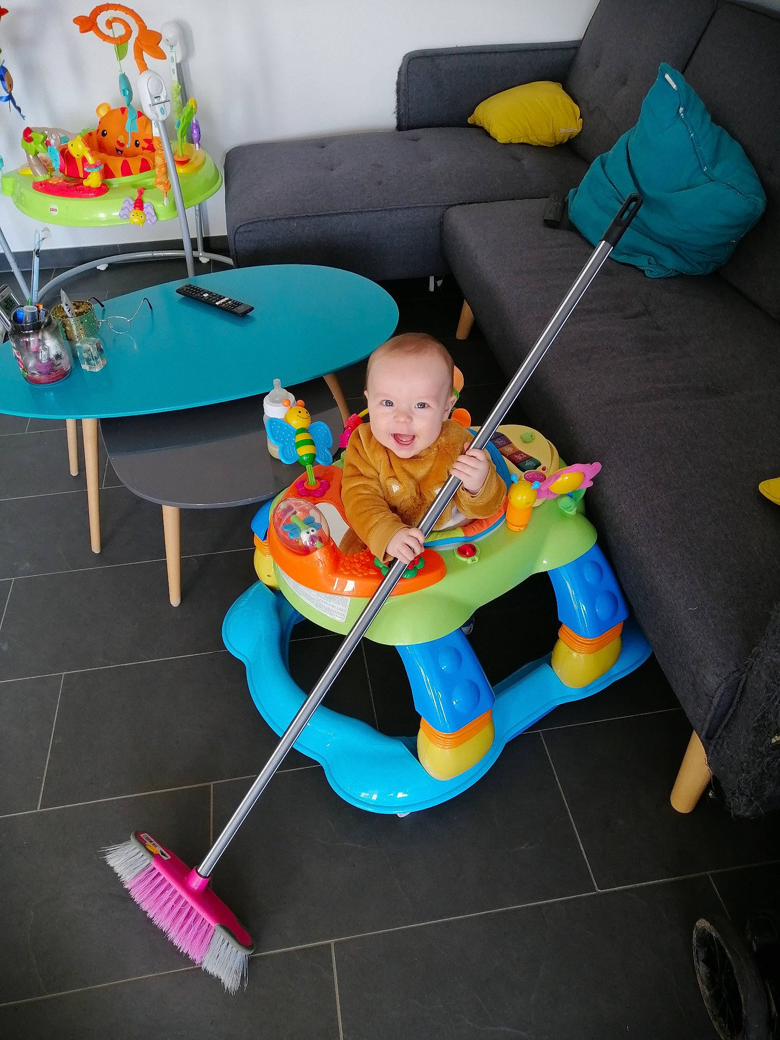 Lyam participe au concours pour gagner de l'argent avec cette photo : armrest, baby, baby_products, baby_toddler_clothing, baby_toys, comfort, couch, floor, flooring, lap, living_room, outdoor_shoe, person, pillow, play, shoe, sitting, sofa_bed, studio_couch, toy