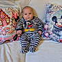 Kynaï a rejoint le concours — aidez-le/la à gagner de superbes lots ! baby, child, striped_clothing, mickey_mouse, pajamas, pillow, disney, cartoon_characters, couch, blanket, indoor, portrait, cute, smiling, sitting, soft_texture, home, decor, infant, person