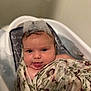 Sage is registered to the contest to win money with this photo: baby, infant, bath, bathtub, foam, bubbles, blanket, floral, wrapped, cute, playful, tongue_out, water, skin, face, head, wet_hair, child, indoors, portrait