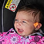 Sage is registered to the contest to win money with this photo: baby, infant, smiling, happy, car_seat, blanket, pink, minnie_mouse, child, face, person, clothing, cute, indoors, head, cheerful, blue_eyes, young, seat, warning_label