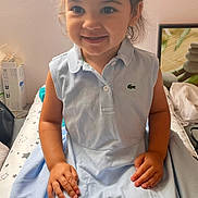 Vittoria a rejoint le concours — aidez-le/la à gagner de superbes lots ! child, toddler, girl, smile, pigtails, dress, blue_dress, indoor, portrait, happy, cute, seated, hands, face, person, young_child, hair, casual, light, cozy