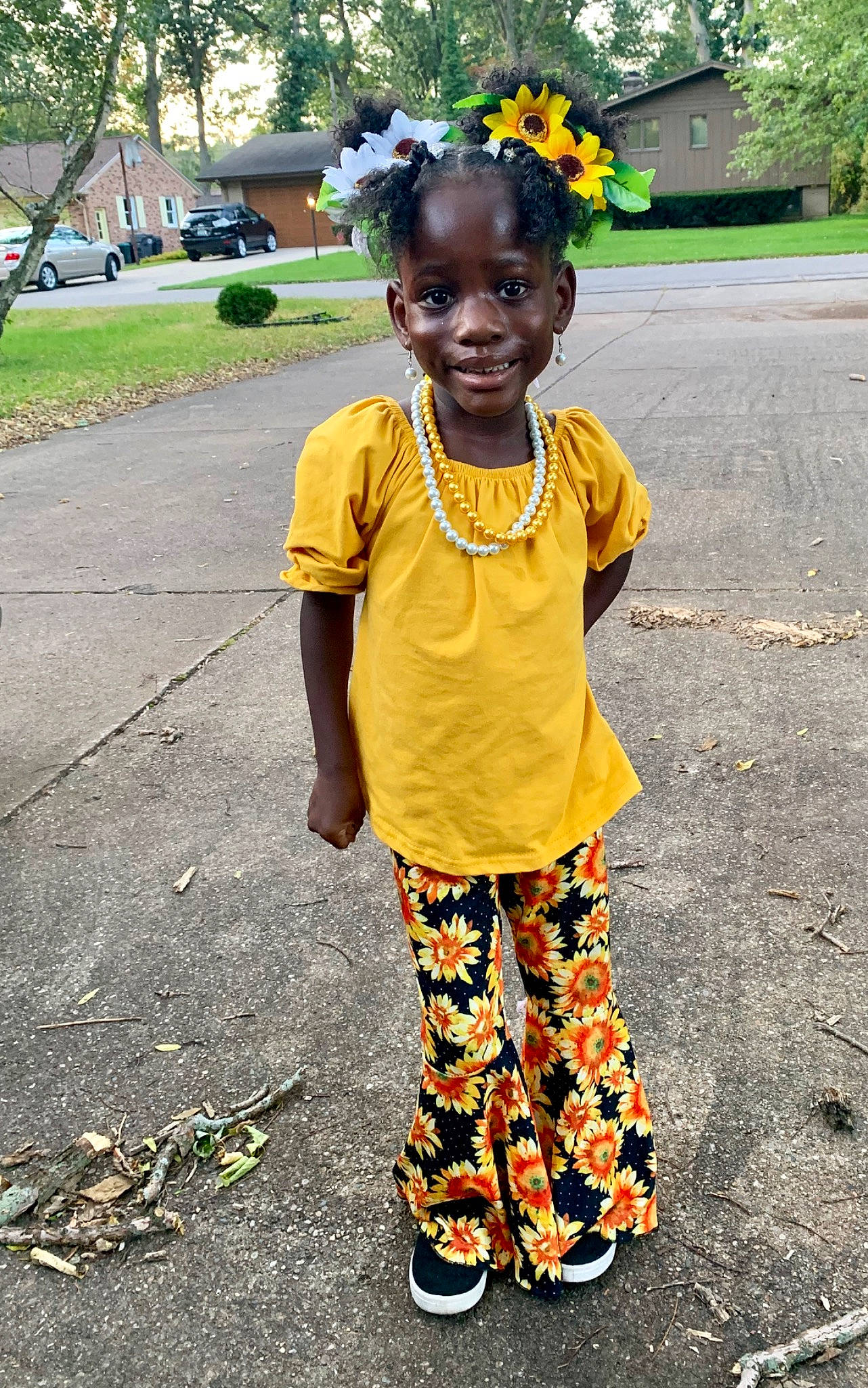 Starr is registered to the contest to win money with this photo: adaptation, child, people, person, plant, shoe, smile, yellow