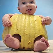 Elijah is registered to the contest to win money with this photo: baby, blue_wall, child, chubby, cute, face, feet, floor, funny, hands, hollow, indoors, infant, person, playful, pumpkin, skin, smile, tongue, yellow
