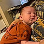 Bennett is registered to the contest to win money with this photo: baby, sleeping, infant, person, child, hand, clothing, tshirt, indoor, closeup, cozy, rest, peaceful, skin, arm, face, nap, human, caring, comfort