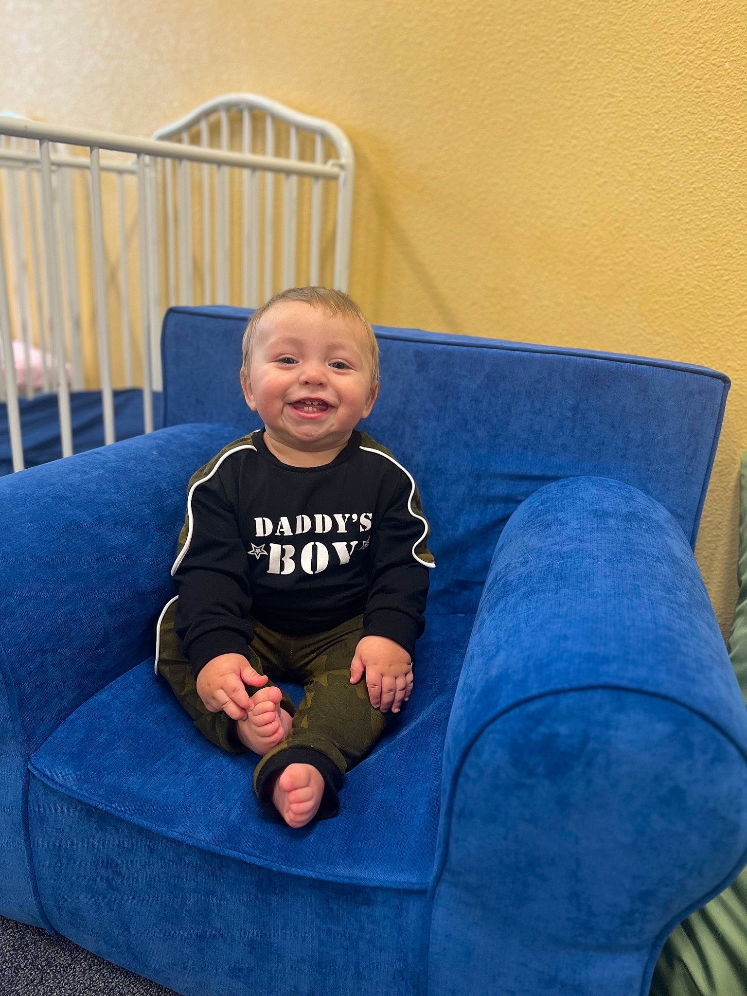 Johnny joined the competition — help win amazing prizes! baby_toddler_clothing, comfort, couch, electric_blue, eye, face, happy, human_leg, joy, knee, lap, leg, living_room, person, purple, sitting, sleeve, smile, sock, sofa_bed