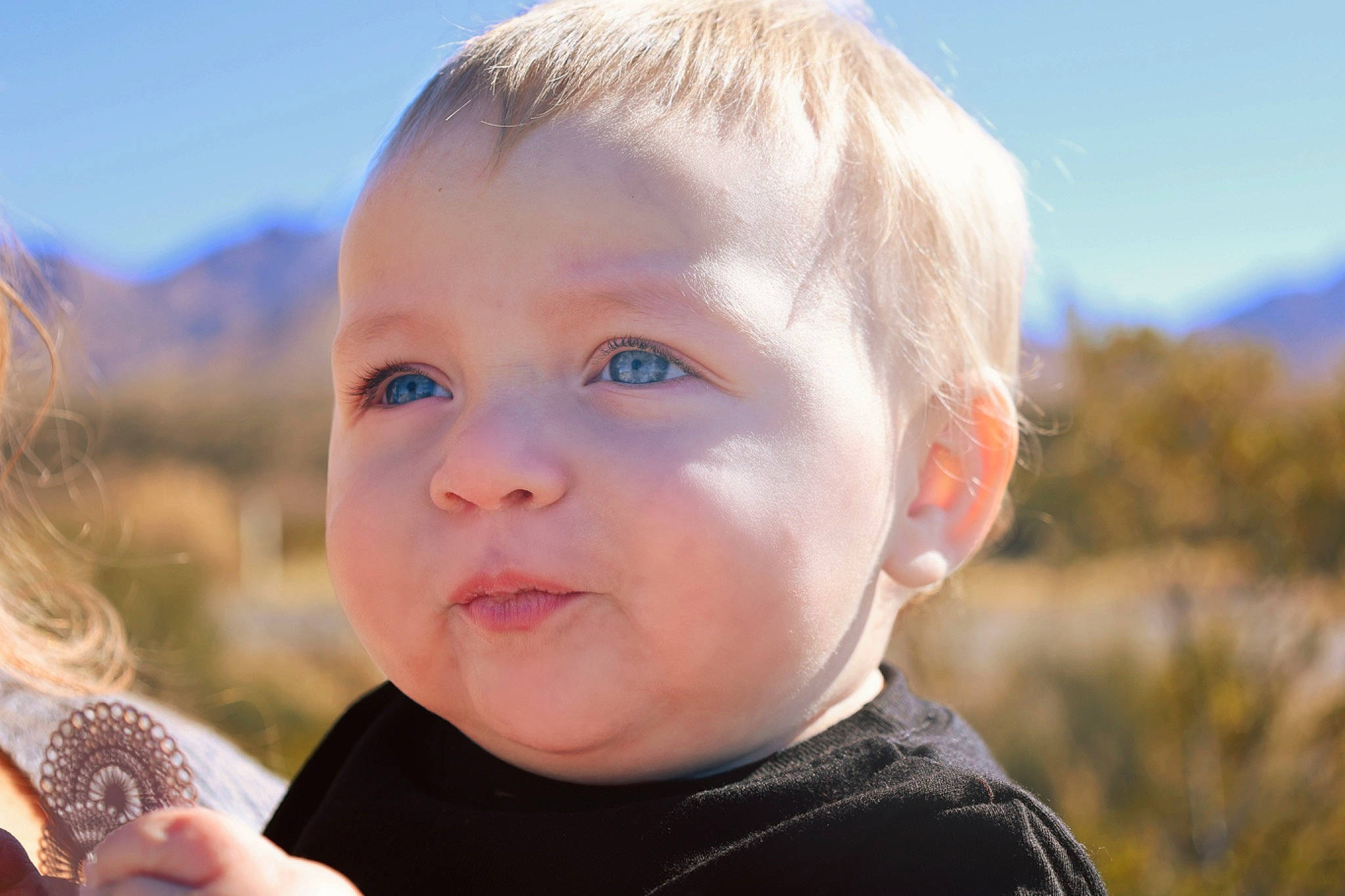 Johnny joined the competition — help win amazing prizes! baby, baby_toddler_clothing, blond, child, close_up, cloud, fun, grass, happy, iris, leisure, lip, nose, people, people_in_nature, person, sitting, skin, sky, toddler